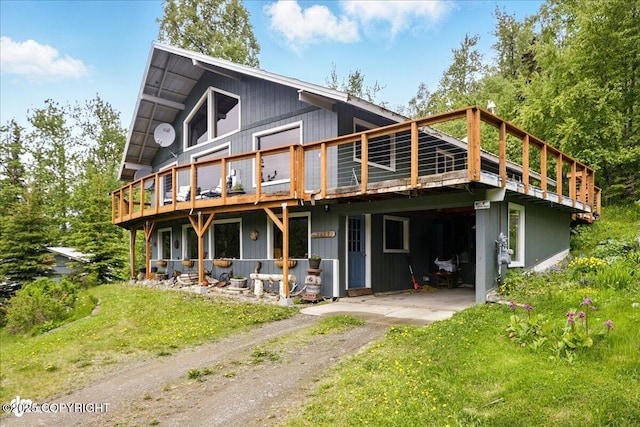 3669 Pullen Cir, Eagle River, AK 99577 - back of house with a deck and driveway