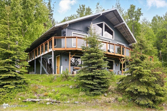 3669 Pullen Cir, Eagle River, AK 99577 - rear view of property featuring a deck and stairs