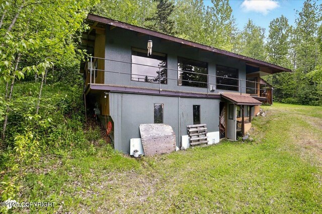 3669 Pullen Cir, Eagle River, AK 99577 - rear view of property with a lawn