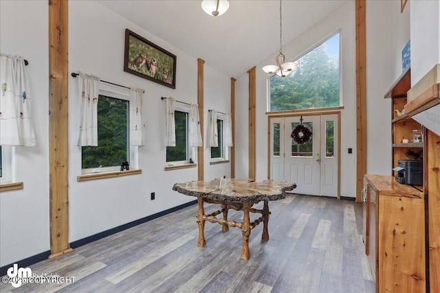 10912 Wolf Trail Cir, Seward, AK 99664 - entryway with high vaulted ceiling, wood finished floors, and a chandelier