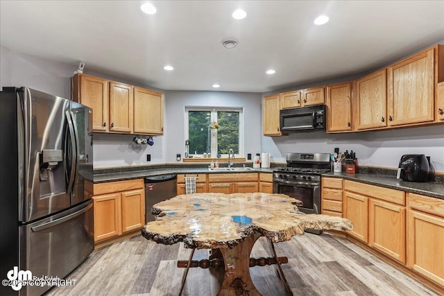 10912 Wolf Trail Cir, Seward, AK 99664 - kitchen with appliances with stainless steel finishes, light wood-type flooring, recessed lighting, and light brown cabinets