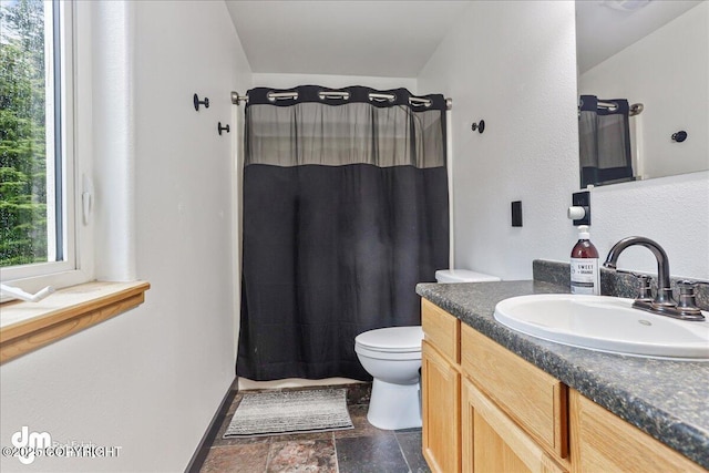 10912 Wolf Trail Cir, Seward, AK 99664 - full bath with vanity, a shower with shower curtain, and stone finish floors