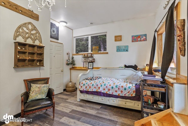 10912 Wolf Trail Cir, Seward, AK 99664 - bedroom with wood finished floors and multiple windows