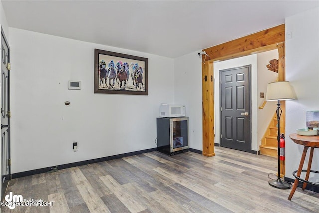 10912 Wolf Trail Cir, Seward, AK 99664 - entrance foyer with wood finished floors and stairway