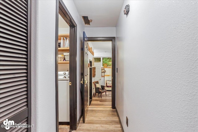 10912 Wolf Trail Cir, Seward, AK 99664 - hallway with light wood-style floors and a textured wall