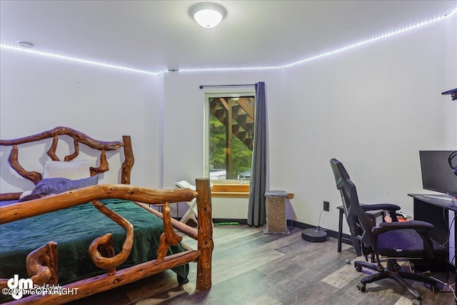 10912 Wolf Trail Cir, Seward, AK 99664 - bedroom featuring wood finished floors and a desk