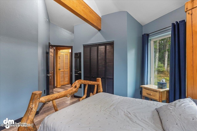 10912 Wolf Trail Cir, Seward, AK 99664 - bedroom featuring vaulted ceiling and wood finished floors