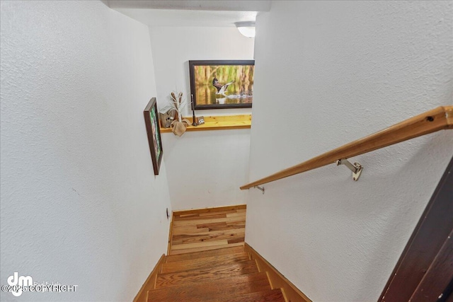 10912 Wolf Trail Cir, Seward, AK 99664 - stairway with wood finished floors and a textured wall