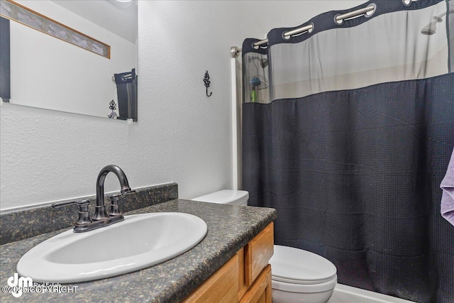 10912 Wolf Trail Cir, Seward, AK 99664 - bathroom featuring vanity, a textured wall, and a shower with curtain