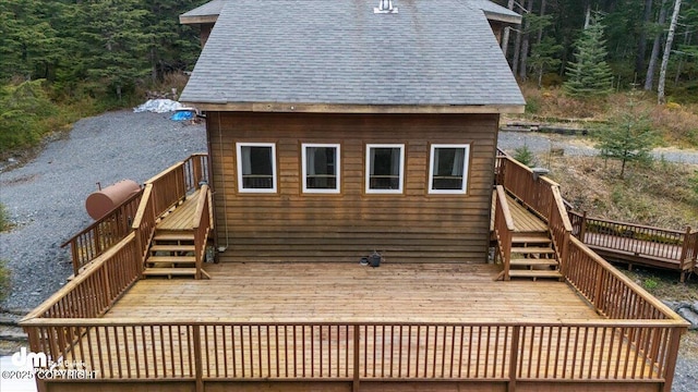 10912 Wolf Trail Cir, Seward, AK 99664 - wooden deck with stairs and a forest view