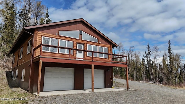 575 Pace St, Soldotna, AK 99669 - view of front facade featuring a garage, driveway, and a deck