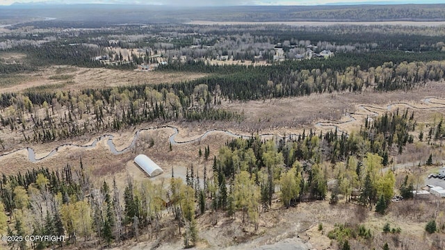 575 Pace St, Soldotna, AK 99669 - aerial view of property and surrounding area featuring a heavily wooded area