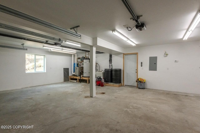 575 Pace St, Soldotna, AK 99669 - garage featuring a garage door opener, gas water heater, and electric panel