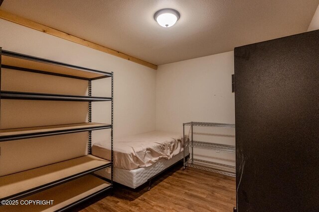 575 Pace St, Soldotna, AK 99669 - bedroom featuring wood finished floors