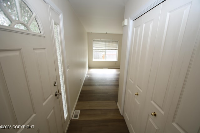 11725 Birch Knoll Loop, Anchorage, AK 99515 - hallway featuring dark wood finished floors and plenty of natural light