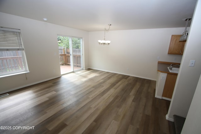 11725 Birch Knoll Loop, Anchorage, AK 99515 - unfurnished dining area with a chandelier and wood finished floors