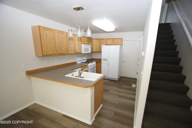 11725 Birch Knoll Loop, Anchorage, AK 99515 - kitchen featuring white appliances, dark wood-style flooring, a peninsula, and pendant lighting