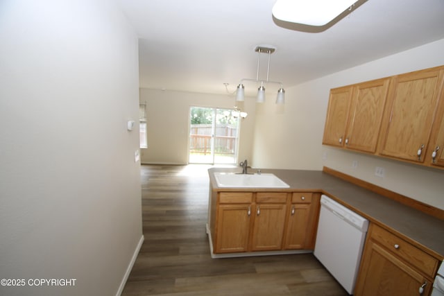 11725 Birch Knoll Loop, Anchorage, AK 99515 - kitchen featuring white dishwasher, a peninsula, wood finished floors, and pendant lighting