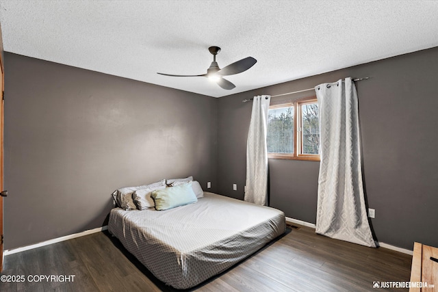 3810 Midvale Cir, Anchorage, AK 99507 - bedroom with baseboards, ceiling fan, a textured ceiling, and wood finished floors
