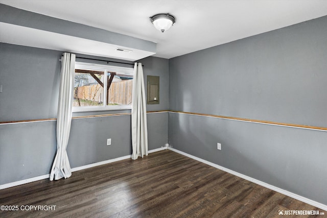 3810 Midvale Cir, Anchorage, AK 99507 - spare room featuring baseboards, visible vents, and wood finished floors