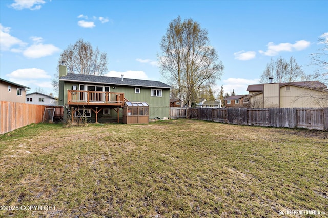 3810 Midvale Cir, Anchorage, AK 99507 - rear view of property with a yard, a chimney, a deck, and a fenced backyard