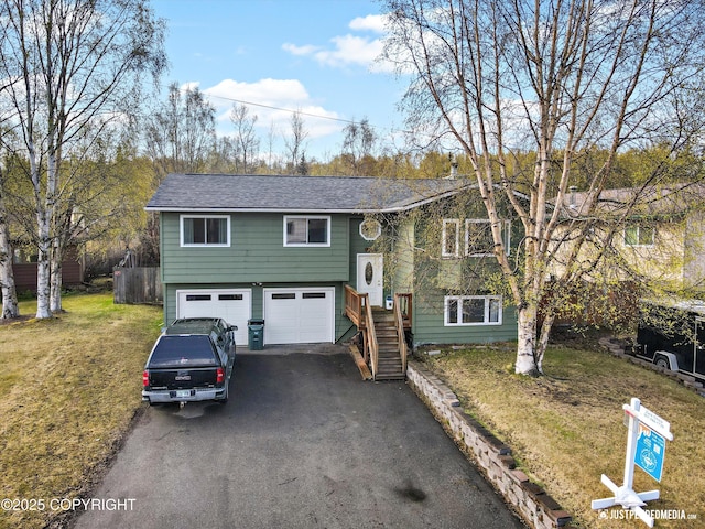 3810 Midvale Cir, Anchorage, AK 99507 - raised ranch featuring aphalt driveway, roof with shingles, a garage, and a front yard
