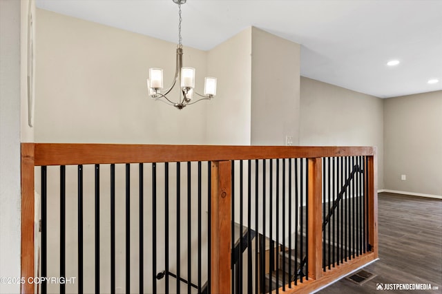 3810 Midvale Cir, Anchorage, AK 99507 - hall with a notable chandelier, recessed lighting, baseboards, wood finished floors, and an upstairs landing