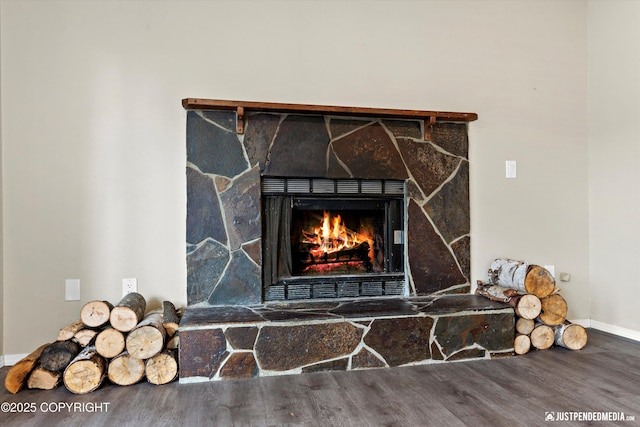 3810 Midvale Cir, Anchorage, AK 99507 - interior details featuring baseboards, a stone fireplace, and wood finished floors