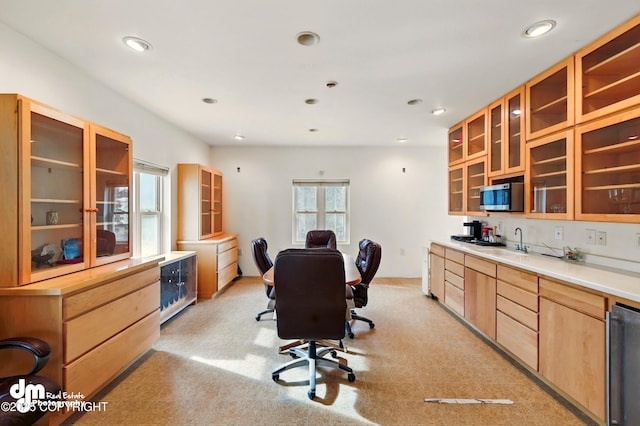 29425 Fools Gold St, Soldotna, AK 99669 - kitchen with stainless steel microwave, light colored carpet, glass insert cabinets, recessed lighting, and light brown cabinets