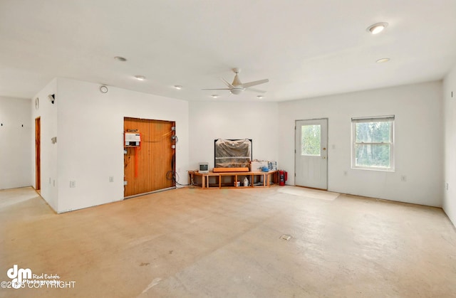 29425 Fools Gold St, Soldotna, AK 99669 - interior space featuring a ceiling fan and concrete flooring