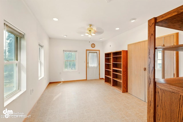 29425 Fools Gold St, Soldotna, AK 99669 - unfurnished living room with a ceiling fan, baseboards, and recessed lighting
