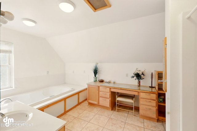 29425 Fools Gold St, Soldotna, AK 99669 - full bath with lofted ceiling, a garden tub, tile patterned flooring, and a sink