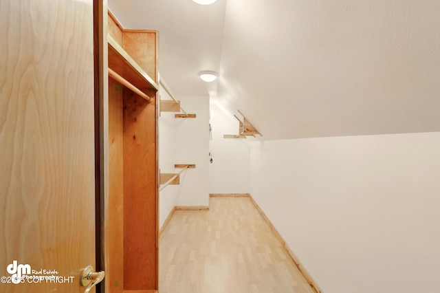 29425 Fools Gold St, Soldotna, AK 99669 - spacious closet with light wood finished floors and vaulted ceiling