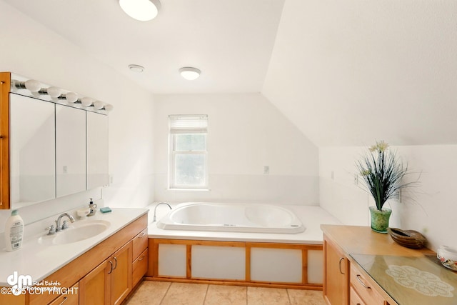 29425 Fools Gold St, Soldotna, AK 99669 - bathroom with a bath, vanity, lofted ceiling, and tile patterned flooring