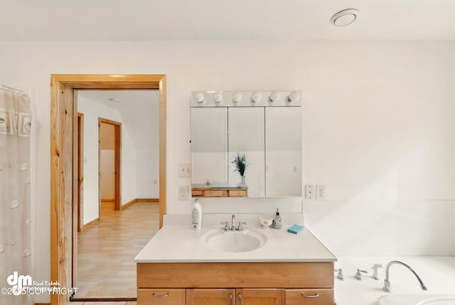 29425 Fools Gold St, Soldotna, AK 99669 - bathroom with vanity and wood finished floors