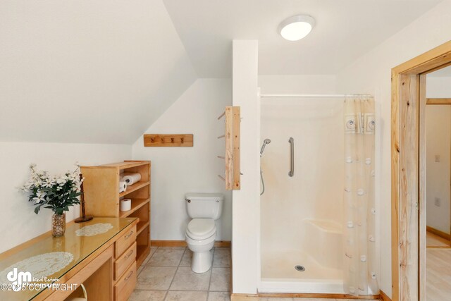 29425 Fools Gold St, Soldotna, AK 99669 - full bathroom featuring a shower stall, lofted ceiling, toilet, and baseboards