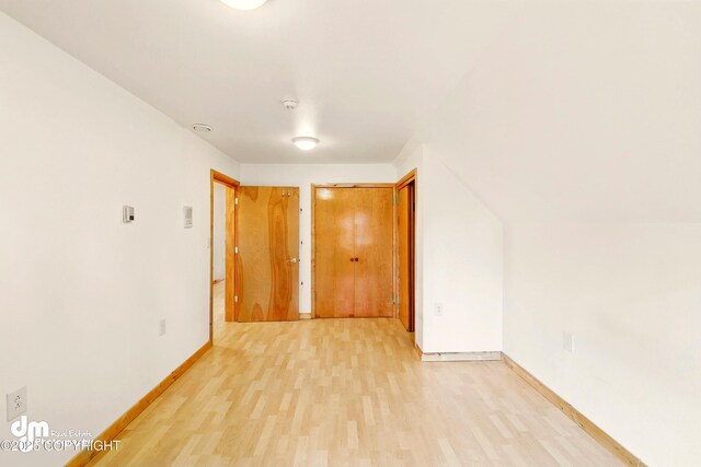 29425 Fools Gold St, Soldotna, AK 99669 - spare room with light wood finished floors, baseboards, and a smoke detector