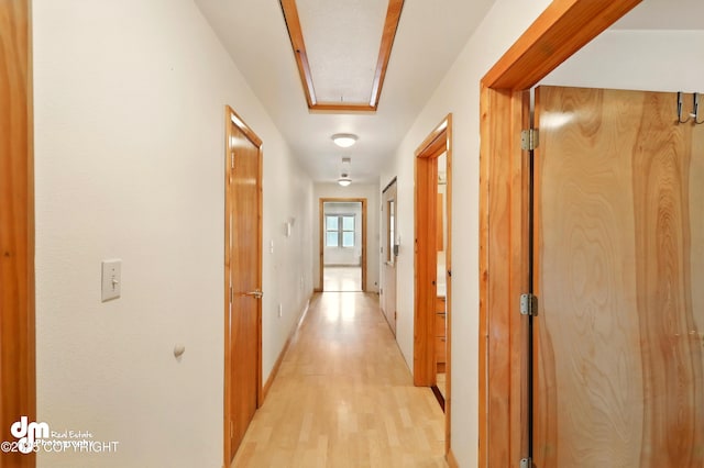 29425 Fools Gold St, Soldotna, AK 99669 - hallway featuring attic access, light wood-type flooring, and baseboards
