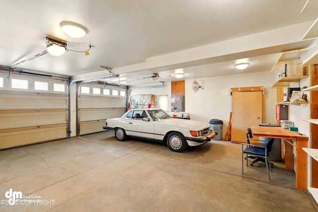 29425 Fools Gold St, Soldotna, AK 99669 - garage featuring a garage door opener and electric panel
