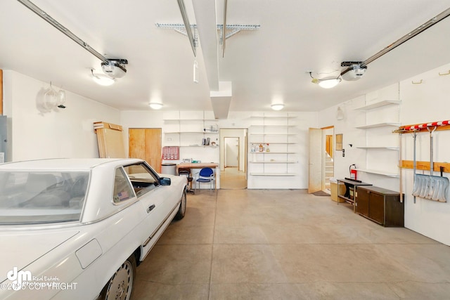 29425 Fools Gold St, Soldotna, AK 99669 - garage featuring a garage door opener and electric panel