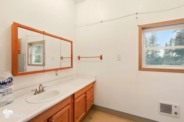 29425 Fools Gold St, Soldotna, AK 99669 - bathroom featuring vanity, heating unit, and baseboards