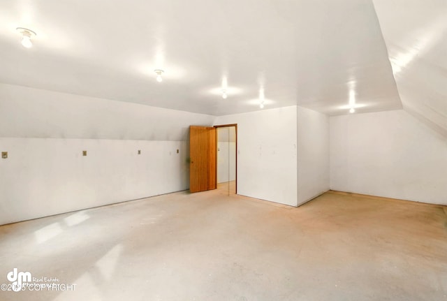 29425 Fools Gold St, Soldotna, AK 99669 - additional living space featuring lofted ceiling and concrete flooring