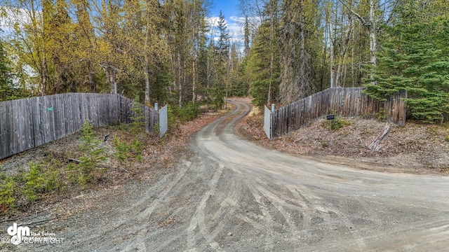 29425 Fools Gold St, Soldotna, AK 99669 - view of dirt / gravel road with a view of trees