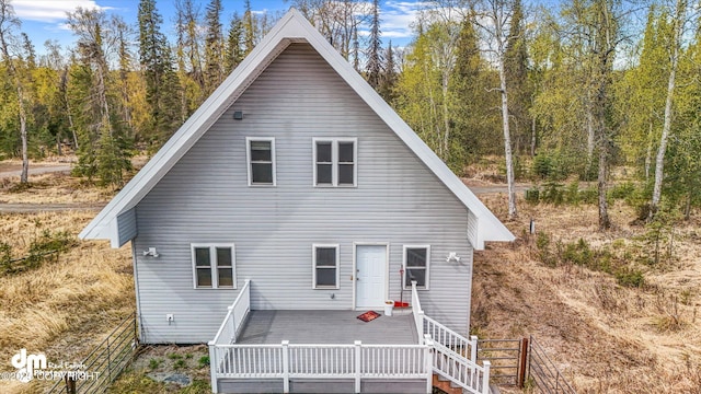 29425 Fools Gold St, Soldotna, AK 99669 - back of house featuring a deck and a forest view