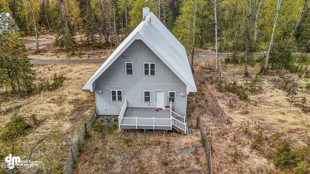 29425 Fools Gold St, Soldotna, AK 99669 - view of front of home with a wooded view and a wooden deck