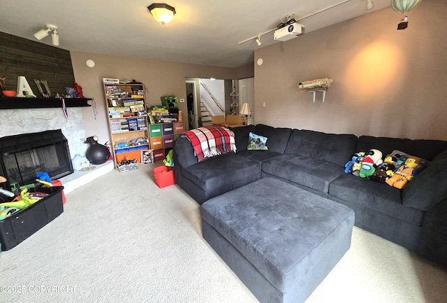 1902 Swetmann Ave, Seward, AK 99664 - living area featuring stairway, carpet, and a fireplace
