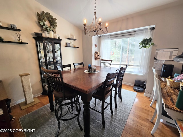 1902 Swetmann Ave, Seward, AK 99664 - dining space featuring an inviting chandelier, baseboards, and wood finished floors
