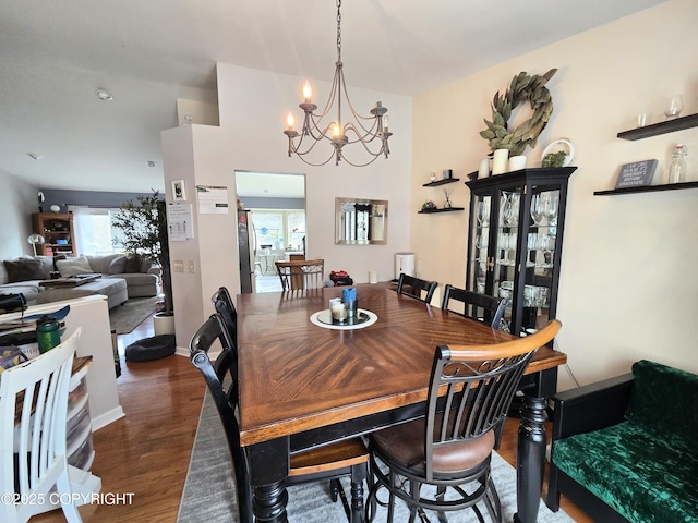 1902 Swetmann Ave, Seward, AK 99664 - dining area featuring baseboards, an inviting chandelier, and wood finished floors