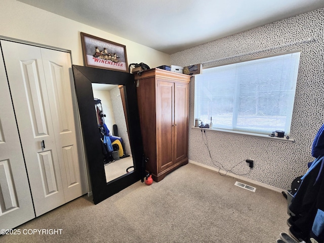 1902 Swetmann Ave, Seward, AK 99664 - unfurnished bedroom with visible vents, light carpet, and a closet