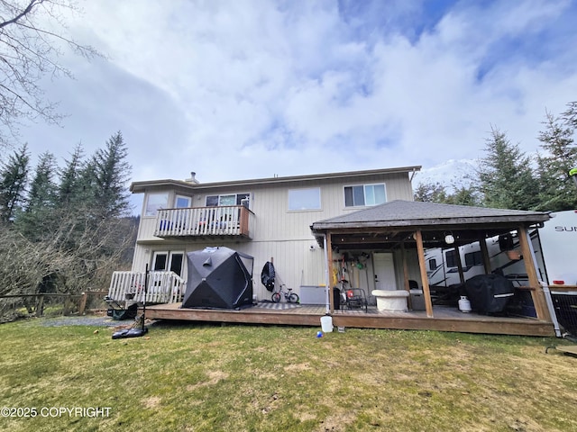 1902 Swetmann Ave, Seward, AK 99664 - rear view of property featuring a yard, fence, a wooden deck, and a balcony